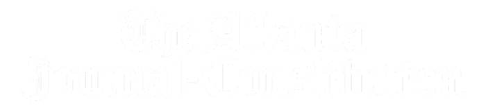 Logo of The Atlanta Journal-Constitution, displaying its name in a white, ornate gothic font on a transparent background.