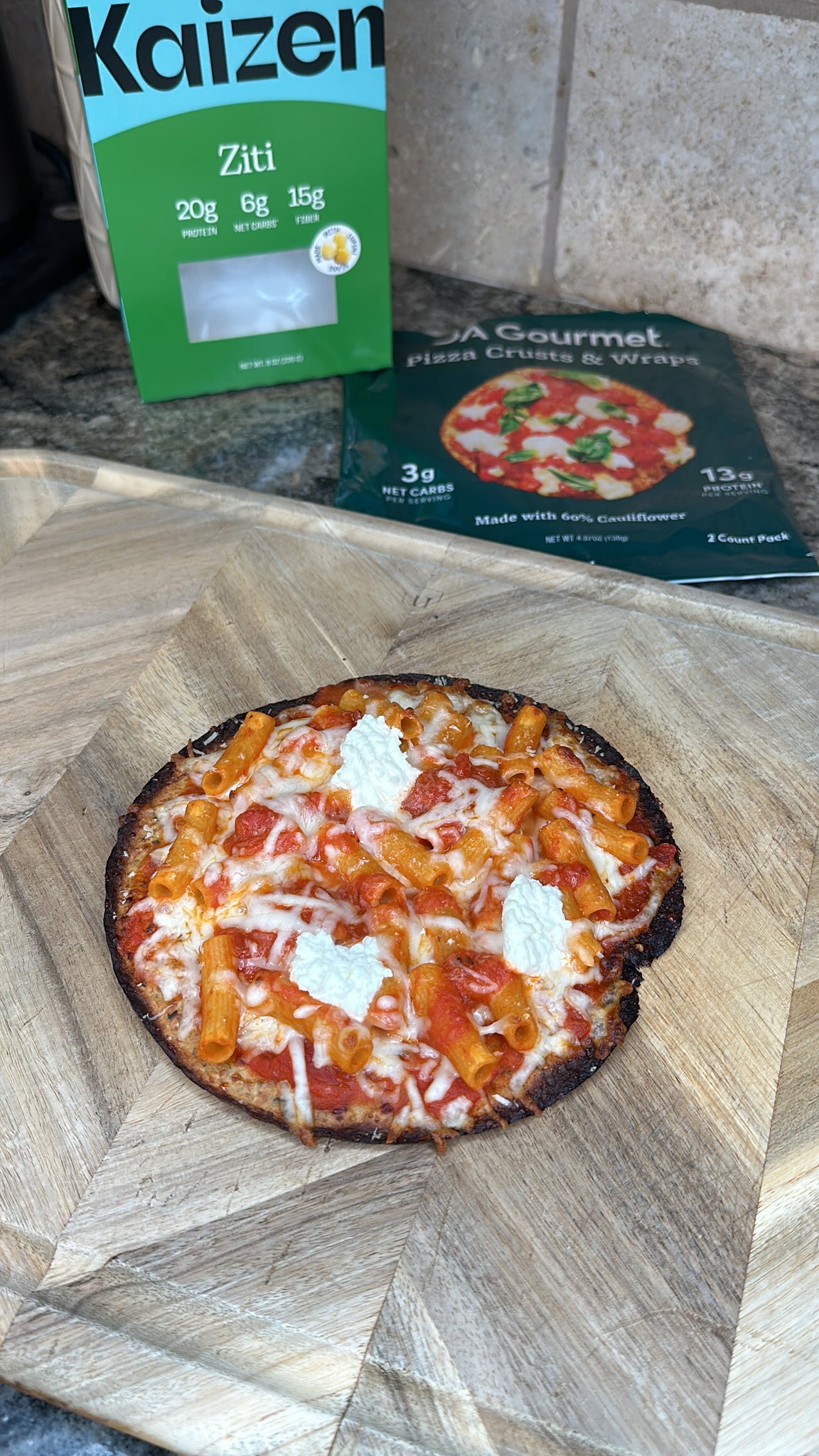 Vodka pizza on a wood cutting board.